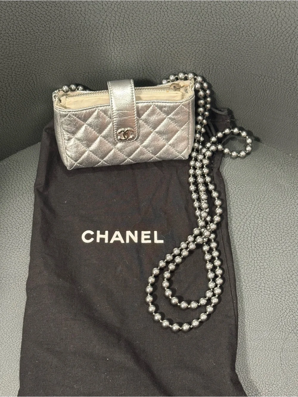 CHANEL Silver Quilted Leather O-Phone Holder with Pearl Chain.